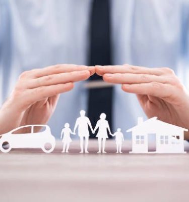 Insurance protecting family health live, house and car concept. Cut elements from paper that symbolize the coverage.